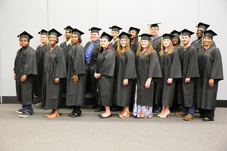 Seventeen of the 21 adult basic education students in East Mississippi Community College’s Adult Basic Education Launch Pad program who earned their high school equivalency diplomas participated in a graduation ceremony the night of Thursday, June 14.